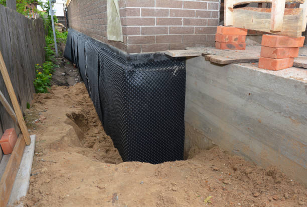 Happy homeowners after waterproofing job in New Castle